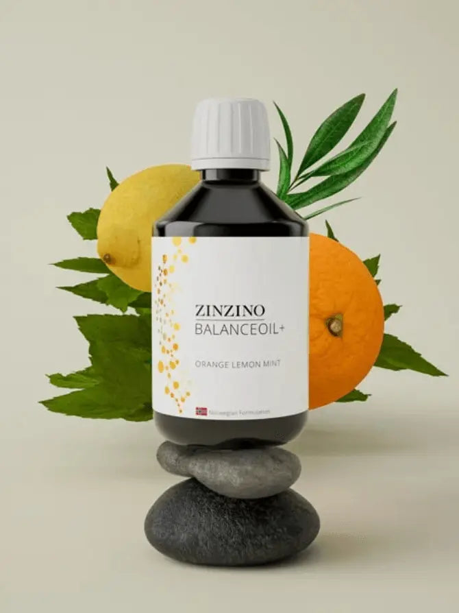 BalanceOil+ Orange Lemon Mint - Zinzino bottle with lemons and oranges on stacked stones